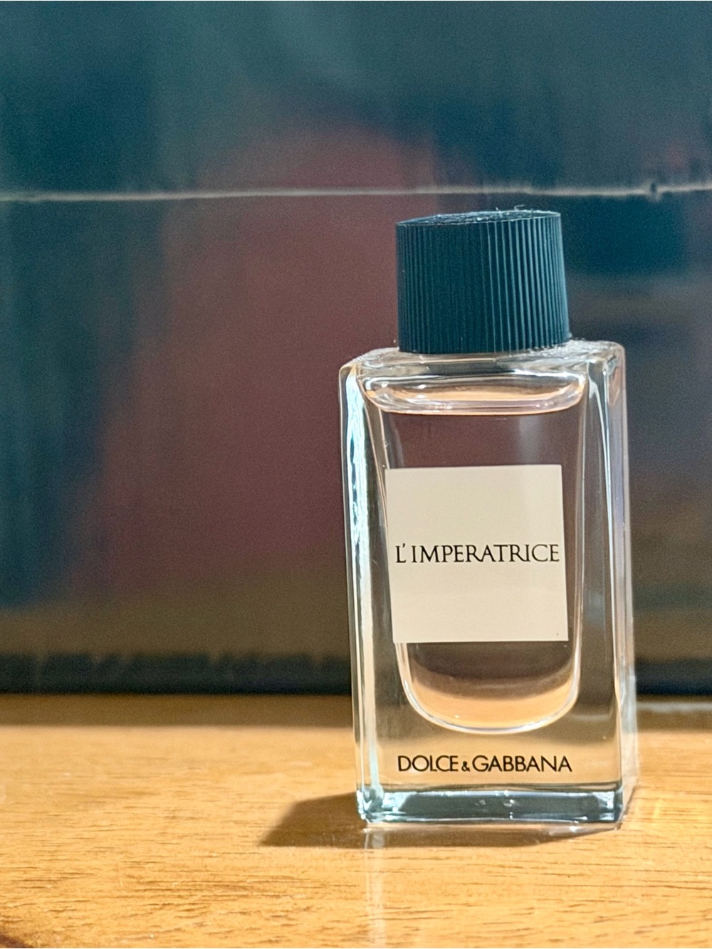 Dolce & Gabbana L'Imperatrice Bottle with Pale Pink Liquid and Black Cap